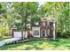 Charming brick two-story home with a well-manicured lawn and mature trees at 516 Aspen Ln, Indian Trail, NC 28079