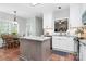 Bright eat-in kitchen with island, breakfast table, stainless appliances, and ample natural light at 516 Aspen Ln, Indian Trail, NC 28079