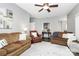 Inviting living room with neutral color palette, ceiling fan, and comfortable seating arrangements at 516 Aspen Ln, Indian Trail, NC 28079