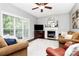 Spacious living room with fireplace, large windows, and comfortable seating at 516 Aspen Ln, Indian Trail, NC 28079