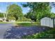 Spacious backyard featuring a shed, grassy lawn, and mature trees at 5428 Barnsdale Ln, Mint Hill, NC 28227