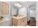 Bright bathroom featuring a vanity and a neutral color palette at 5428 Barnsdale Ln, Mint Hill, NC 28227