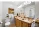Elegant bathroom with dual sinks, granite countertops, and ample lighting at 5428 Barnsdale Ln, Mint Hill, NC 28227