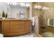 Bathroom featuring double vanities, granite counters, and a glass-enclosed shower at 5428 Barnsdale Ln, Mint Hill, NC 28227