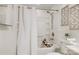 Bathroom featuring a shower-tub combo and a neutral color palette at 5428 Barnsdale Ln, Mint Hill, NC 28227