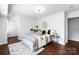 Cozy bedroom with neutral tones, stylish bedding, and hardwood floors at 5428 Barnsdale Ln, Mint Hill, NC 28227