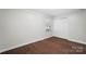 Bright bedroom with hardwood floors, natural light, and ample closet space at 5428 Barnsdale Ln, Mint Hill, NC 28227