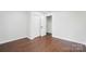 Bright bedroom with hardwood floors, natural light, and ample closet space at 5428 Barnsdale Ln, Mint Hill, NC 28227