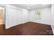 Bright bedroom with hardwood floors, natural light, and ample closet space at 5428 Barnsdale Ln, Mint Hill, NC 28227