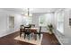 Cozy dining area with natural light, a modern light fixture, and seating for four at 5428 Barnsdale Ln, Mint Hill, NC 28227