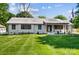 Charming home featuring a manicured front yard and a welcoming porch with wooden accents at 5428 Barnsdale Ln, Mint Hill, NC 28227