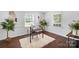 Bright home office with natural light, modern decor, and ample workspace at 5428 Barnsdale Ln, Mint Hill, NC 28227