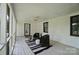 Screened porch is complete with furniture for a relaxing outdoor experience at 5428 Barnsdale Ln, Mint Hill, NC 28227