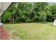 Spacious backyard with a shed surrounded by mature trees at 565 Vine Arden Dr, Salisbury, NC 28146