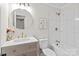Updated bathroom with modern vanity, round mirror, and white tiled shower at 565 Vine Arden Dr, Salisbury, NC 28146