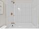 Bathtub features new bronze fixtures and a white tiled shower at 565 Vine Arden Dr, Salisbury, NC 28146