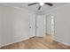 A small bedroom has wood-look floors, a ceiling fan, and two closets at 565 Vine Arden Dr, Salisbury, NC 28146