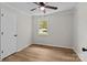 Bright bedroom features a ceiling fan, window, and wood-look floors at 565 Vine Arden Dr, Salisbury, NC 28146