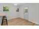 Bright dining area featuring light wood floors and a view of the backyard through a glass door at 565 Vine Arden Dr, Salisbury, NC 28146