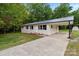 Charming single-story home with a large driveway and attached carport at 565 Vine Arden Dr, Salisbury, NC 28146