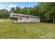 Back exterior of the home features a carport and a large yard at 565 Vine Arden Dr, Salisbury, NC 28146