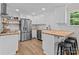 Well-lit kitchen featuring stainless steel appliances and stylish butcher block countertops at 565 Vine Arden Dr, Salisbury, NC 28146