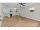 Open-concept living room featuring light wood floors and natural light from the windows at 565 Vine Arden Dr, Salisbury, NC 28146