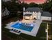 Aerial view of the backyard featuring a large pool, outdoor seating, and manicured lawn at 5806 Bentway Dr, Charlotte, NC 28226