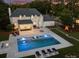 Expansive backyard with luxurious pool, lounge area, and lush landscaping at 5806 Bentway Dr, Charlotte, NC 28226