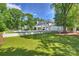 Expansive backyard featuring a pristine pool and manicured lawn, perfect for outdoor enjoyment at 5806 Bentway Dr, Charlotte, NC 28226