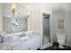 Elegant bathroom featuring a marble countertop, a spacious shower, and modern fixtures at 5806 Bentway Dr, Charlotte, NC 28226