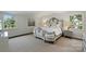 Bedroom featuring a beautiful bed with a decorative headboard, complemented by elegant side tables and artwork at 5806 Bentway Dr, Charlotte, NC 28226