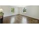 Bright bedroom with hardwood floors and large windows, offering a serene space at 5806 Bentway Dr, Charlotte, NC 28226