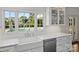 Bright eat-in kitchen with sink overlooking the pool in the backyard at 5806 Bentway Dr, Charlotte, NC 28226