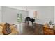 Bright formal living room with a grand piano and stylish seating at 5806 Bentway Dr, Charlotte, NC 28226