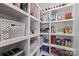 Organized pantry featuring white shelves, baskets, and ample storage for food and kitchen essentials at 5806 Bentway Dr, Charlotte, NC 28226