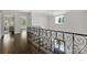 Upstairs hallway overlooking the stairs and front door at 5806 Bentway Dr, Charlotte, NC 28226