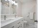 Bathroom with a double sink vanity, modern fixtures, and a marble countertop at 6100 Ashcrest Dr, Charlotte, NC 28217