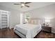 Well-lit bedroom featuring hardwood floors, ample closet space and neutral decor at 6100 Ashcrest Dr, Charlotte, NC 28217