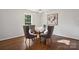 Dining area with a modern chandelier and seating for four at 6100 Ashcrest Dr, Charlotte, NC 28217