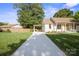 View of the exterior featuring a lengthy driveway with a carport at 6100 Ashcrest Dr, Charlotte, NC 28217