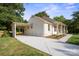A quaint house boasting a carport and a generous driveway at 6100 Ashcrest Dr, Charlotte, NC 28217