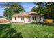 Charming single-story home with a well-manicured lawn and inviting curb appeal at 6100 Ashcrest Dr, Charlotte, NC 28217