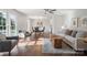 Bright living room with hardwood floors, comfortable seating, and dining area at 6100 Ashcrest Dr, Charlotte, NC 28217