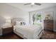 Bedroom with a large window offering plenty of light at 6100 Ashcrest Dr, Charlotte, NC 28217