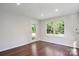 Bright room with a glass door, offering natural light and backyard access at 6100 Ashcrest Dr, Charlotte, NC 28217