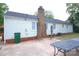A private backyard area with a patio, perfect for outdoor dining and relaxation by the home's exterior at 6124 Coach Hill Ln, Charlotte, NC 28212