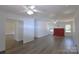 Bright living room with neutral walls, hardwood floors, and a charming fireplace, perfect for relaxing or entertaining at 6124 Coach Hill Ln, Charlotte, NC 28212