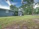 Spacious backyard with lawn and partial view of the home's exterior at 6604 Plyler Mill Rd, Monroe, NC 28112