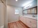 Bathroom featuring a double sink vanity with modern fixtures and great lighting at 6604 Plyler Mill Rd, Monroe, NC 28112